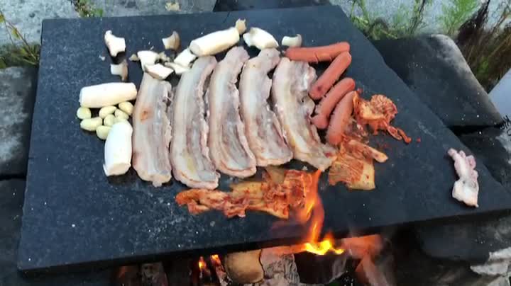 Grilled pork belly on a stone plate