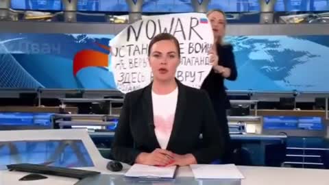 Woman Runs Into Frame, Interrupts Live Russian Broadcast to Protest War in Ukraine