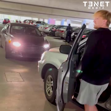 Woman goes against one way traffic in a parking garage, yells at a guy