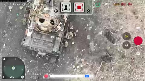 Russians Take Shelter Behind Destroyed Tank