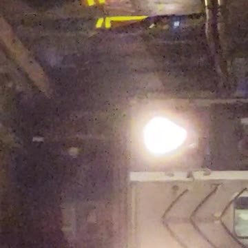 Subway workers agains wall while subway passes by