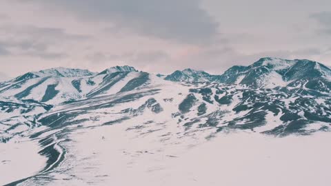 The big cold snow mountain is covered with snow