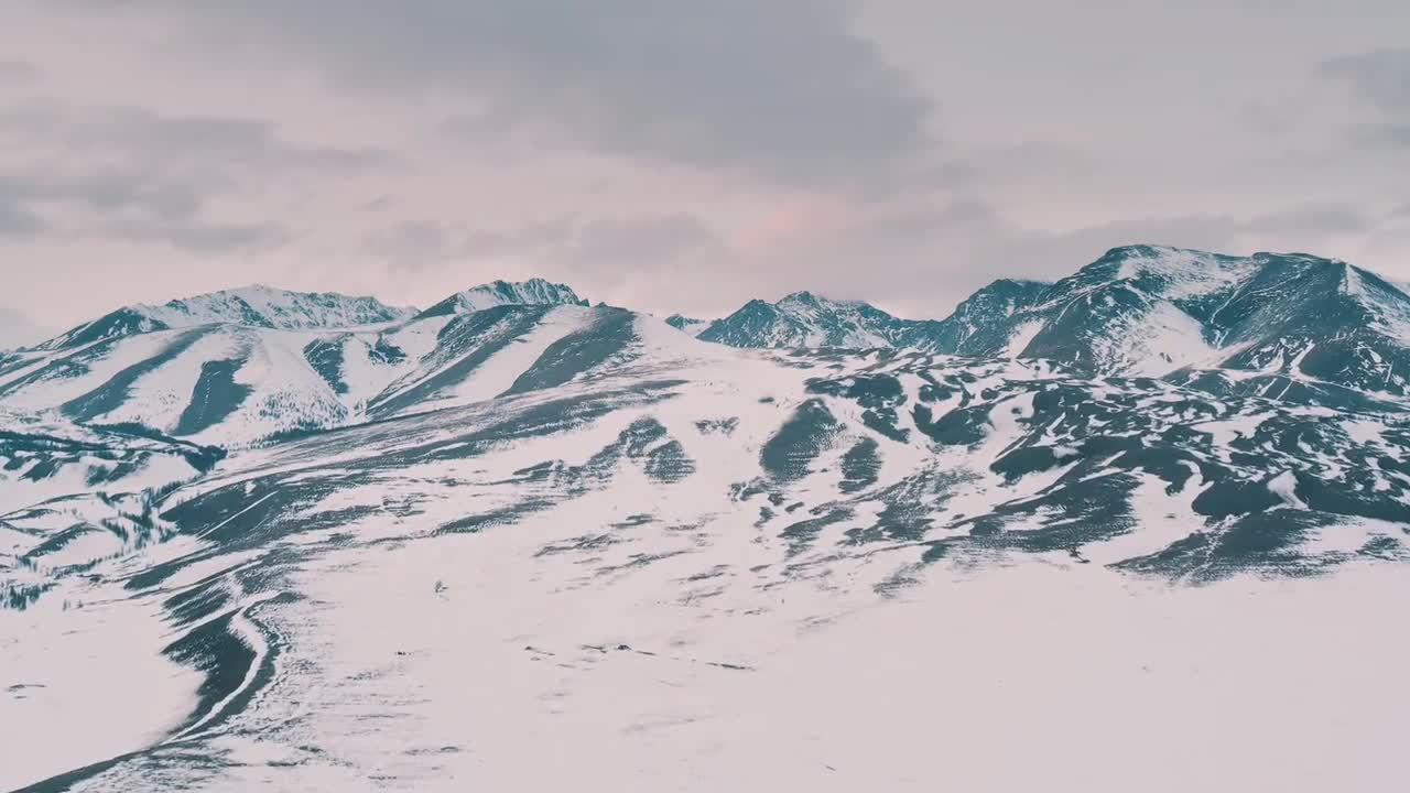 The big cold snow mountain is covered with snow