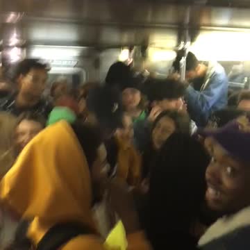Crowded subway full of people all yell yeah