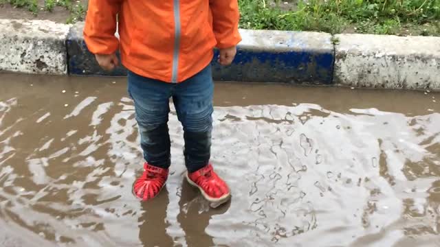 Little bully jumping in a puddle and funny grunts!