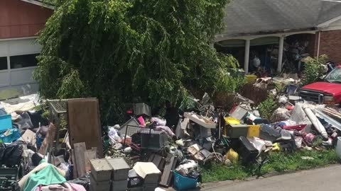 House Blocked by Mountain of Junk