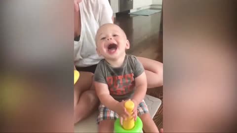 funny baby play with his family