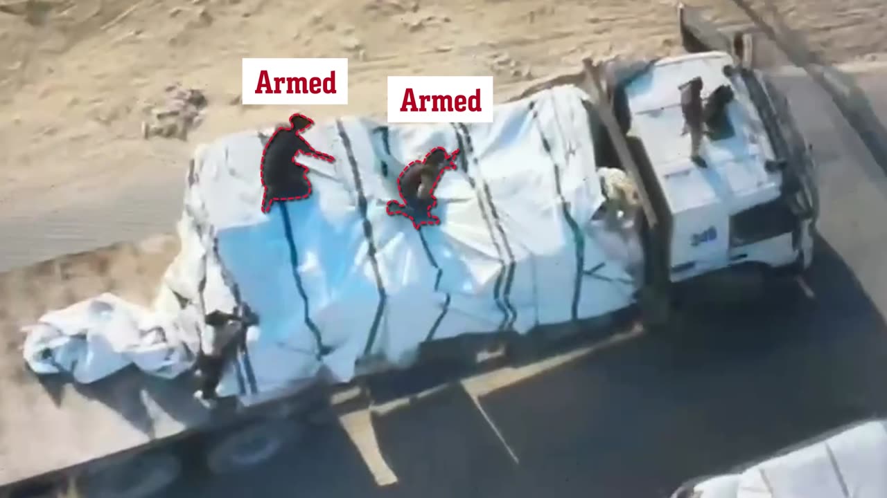 Attached is footage of the armed militants who robbed the aid truck on the