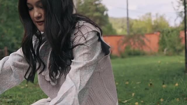 A girl playing with her cat