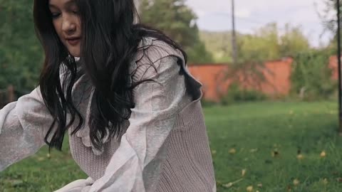 A girl playing with her cat