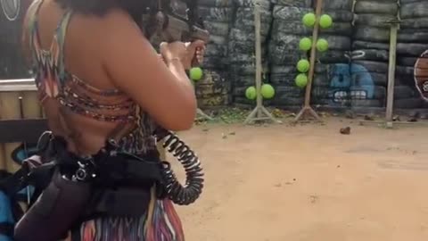 Pretty girl learning how to shoot