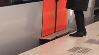 Womans bag stuck inside subway