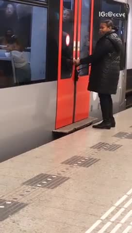 Womans bag stuck inside subway