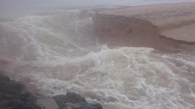 Guy Captures The Moment A River Cuts A New Channel To The Ocean