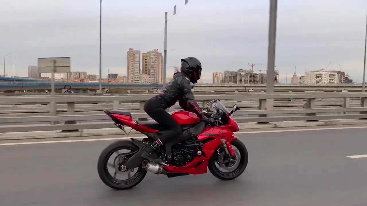 cute girl rides red bike