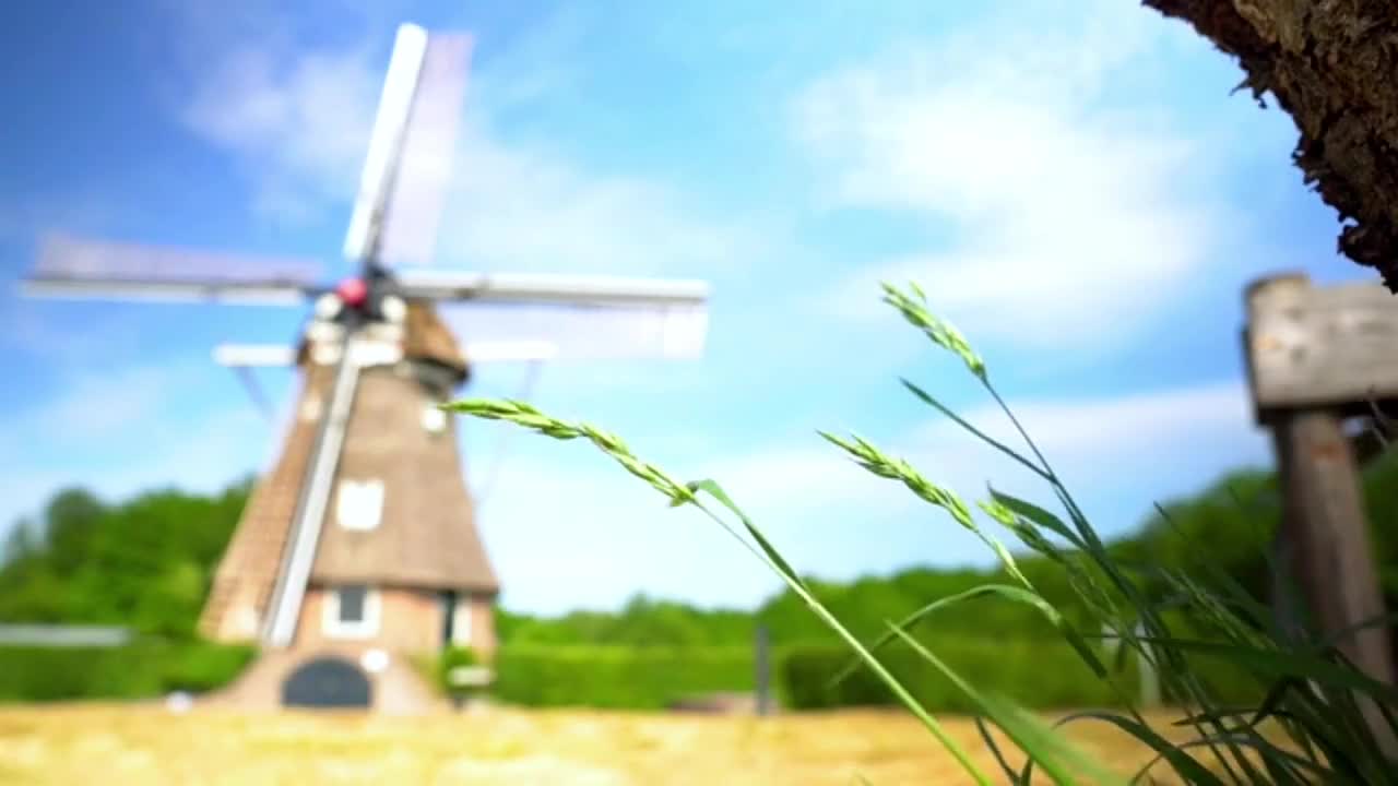 The looming charm, the windmill hidden behind