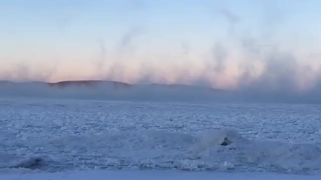 "Sea Smoke" eerily rises over Lake Superior