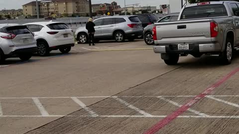 Woman almost hit in parking lot using Cell phone