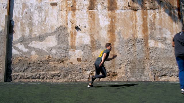 Two men playing with a soccer ball