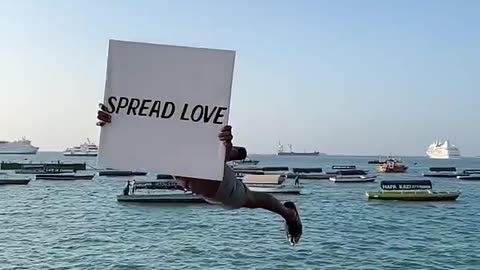 Spreading Beautiful Message To The World While Jumping