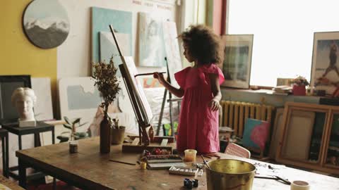 Kid Painting on a Canvas