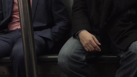 Two men falling asleep next to each other on train