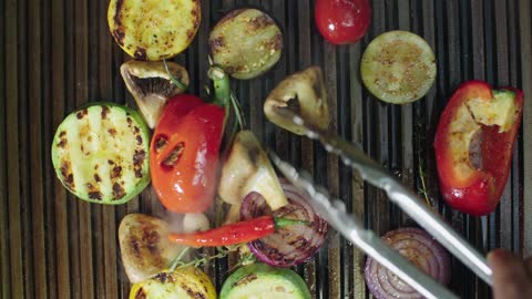 A Variety Of Vegetables Being Grilled