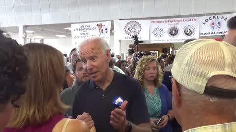 Biden grabs hand of Iowa teacher 2