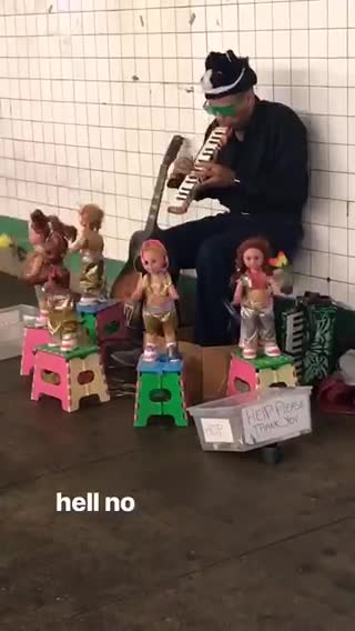 Man playing flute dancing dolls around him
