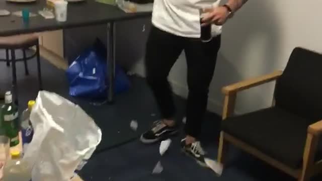 Music guy dancing in living room throws and breaks dish on floor