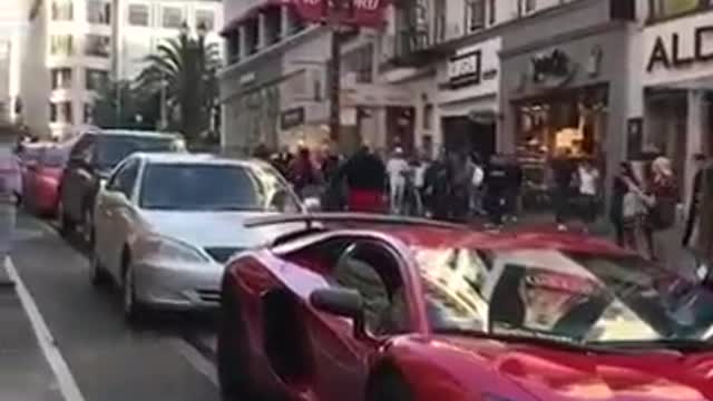 Guy jumps On A Lamborghini Aventador Twice And Gets Delt With!