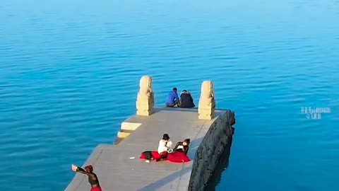 beautiful woman dancing on the pier