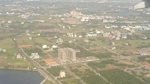 Prepare to land outside the plane window.