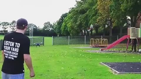 This guy kicks the football into the basketball hoop