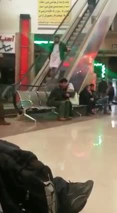 Man Struggles To Walk Down Upward Moving Escalator