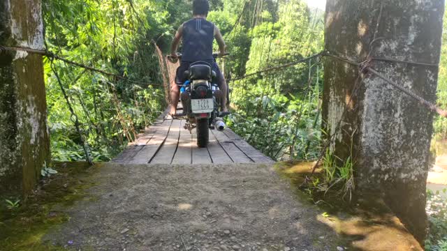 BULLET ACROSS WOODEN BRIDGE