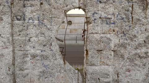 Looking Through a Hole in Berlin Wall