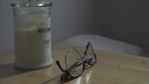 Candles and glasses on the table.