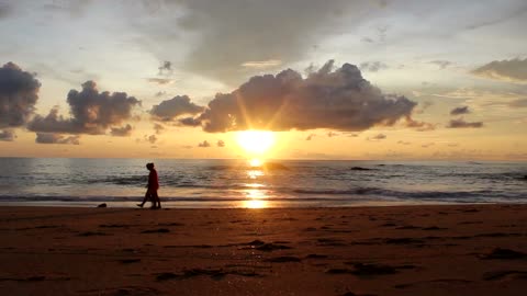 Couple Lovers Cross Beach In Sun Down View