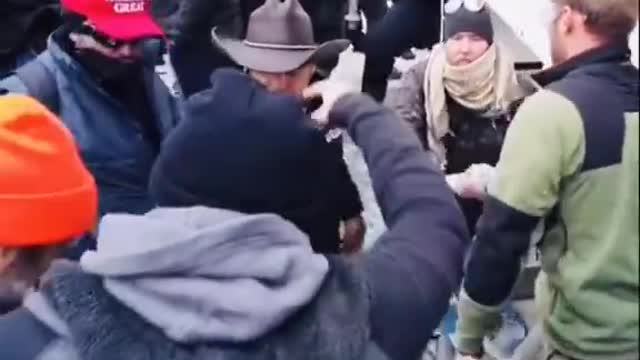 Capitol "Rioters" Passing Weapons to Cops