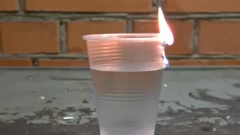 Fire on plastic glass with water