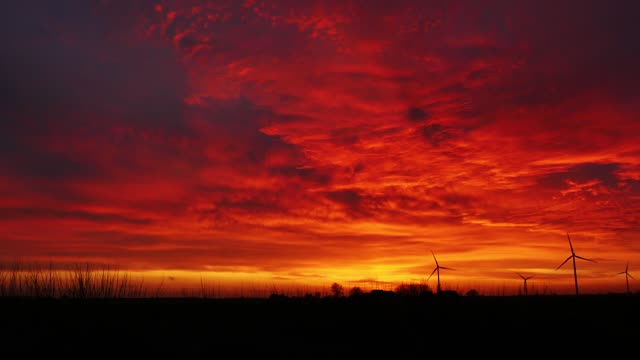 Burning sky and windmills
