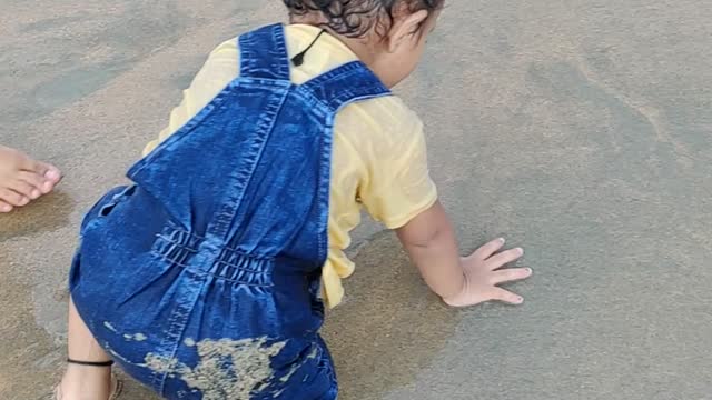 Baby Playing with sea water for first time