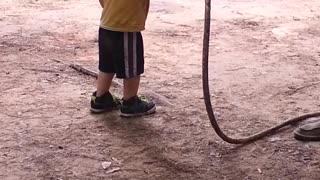 Baby gets attacked by grandpa via water hose!