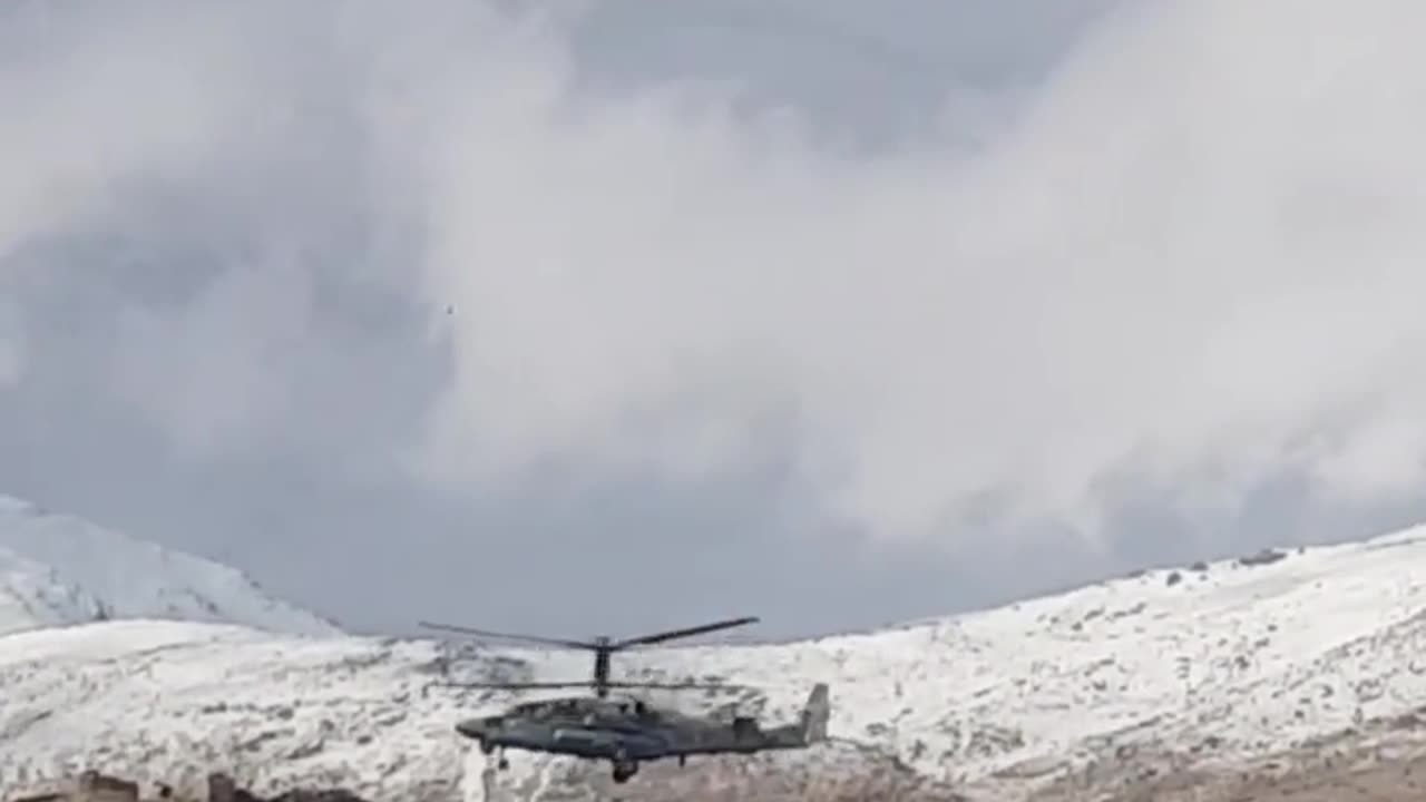 Russian KA52 Attack Helicopter Hovering Near the Syrian Border with Israeli Golan Heights