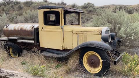 Abandoned Vintage Car on the Open Field