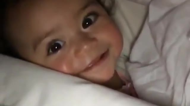 Adorable baby playing with her mom