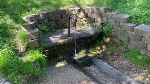 Stock Footage Artesian Well Pipe Stand and Brick Background 50002