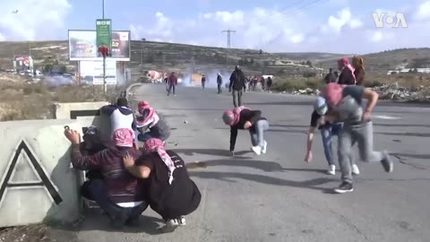 Palestinian protesters clash with Israeli soldiers..