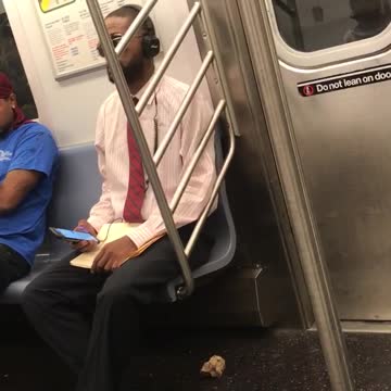 Guy sunglasses white dress shirt red tie headphones music